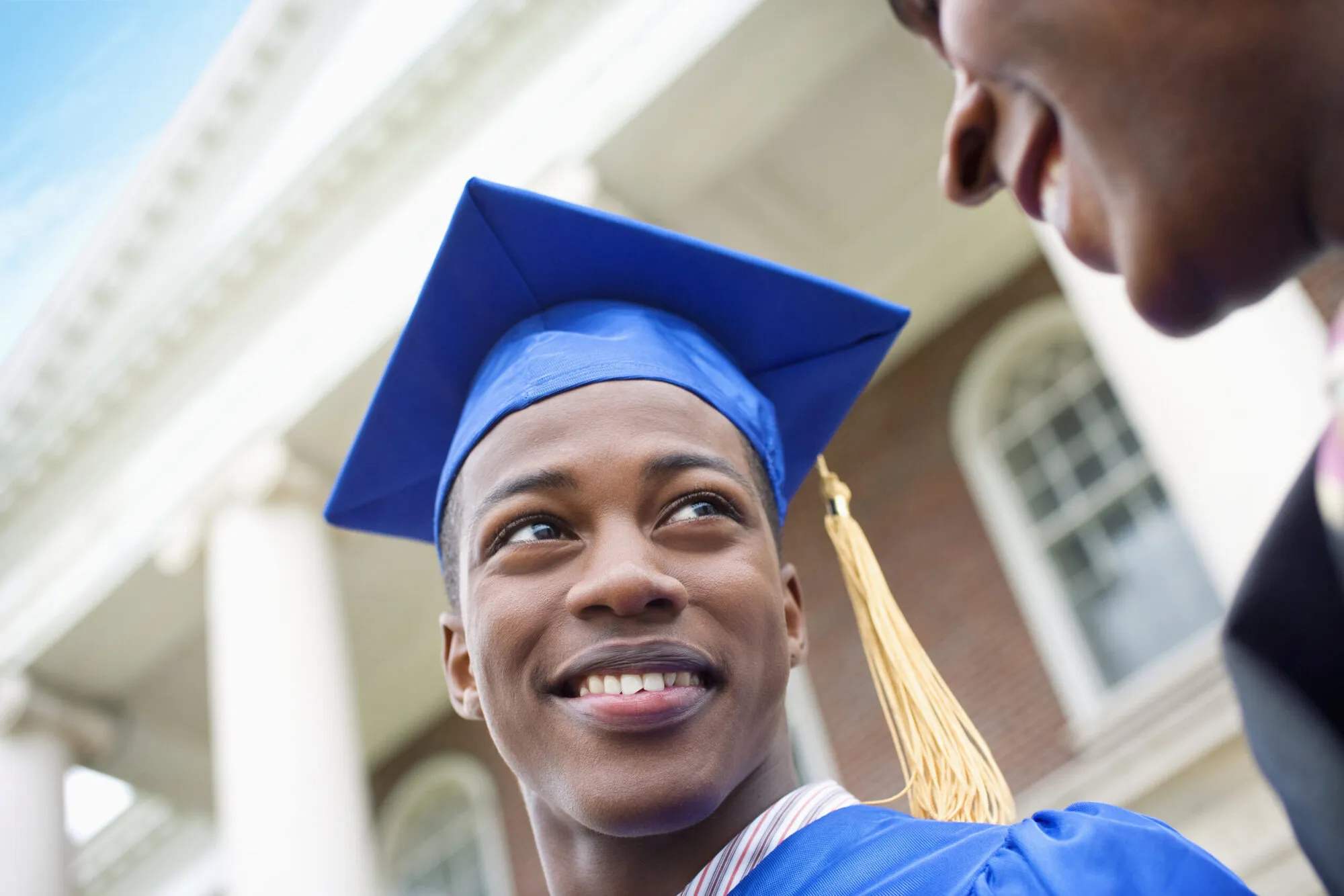 Young Man with Father at College Graduation