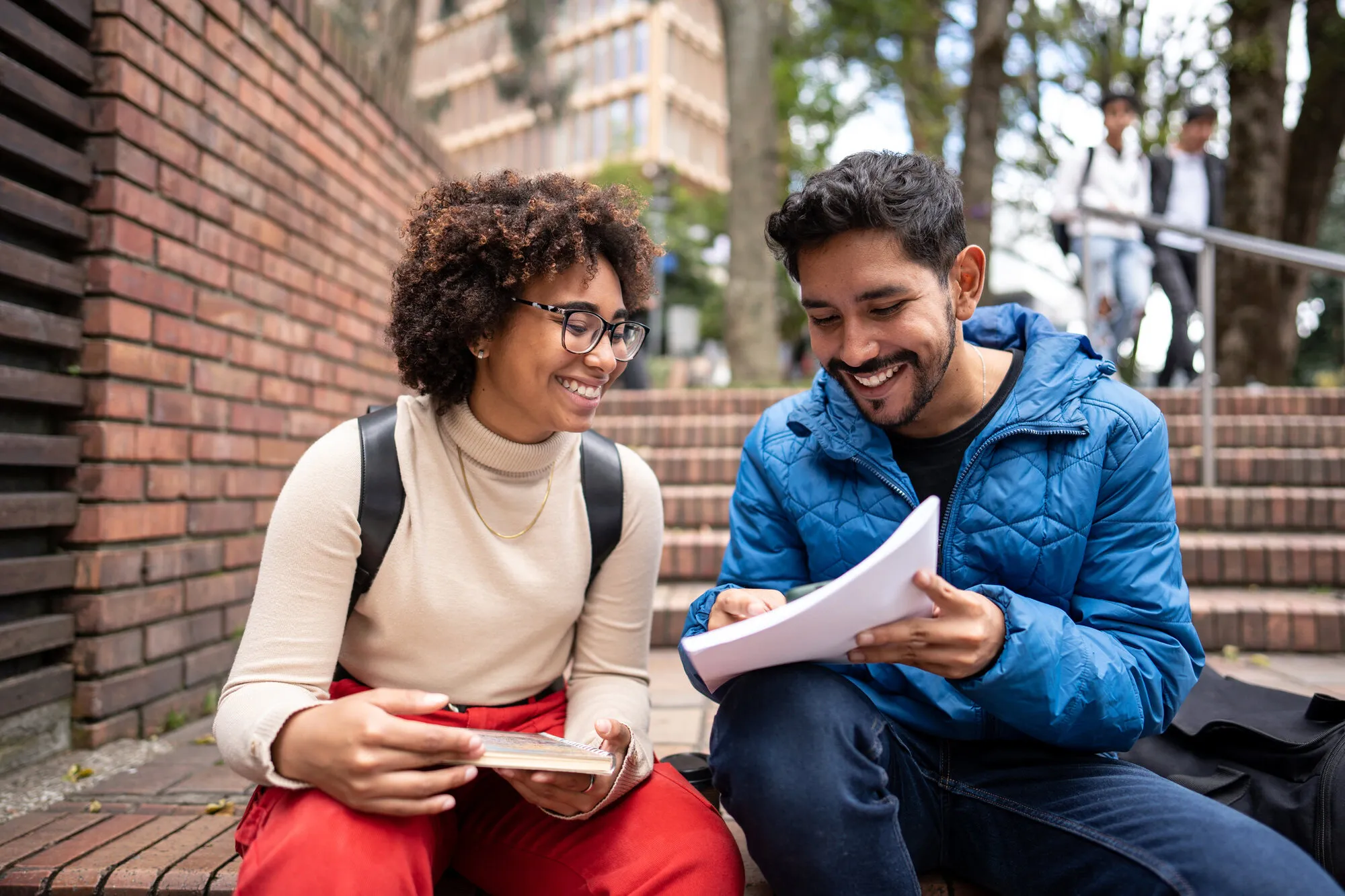 Young university students studying on stair outdoors